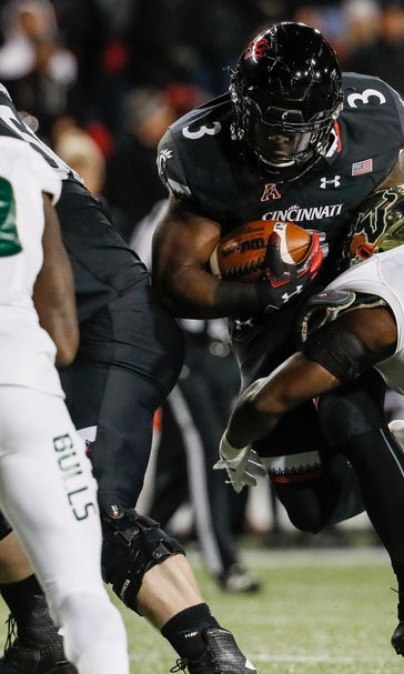 Warren’s 4 TDs lead No. 25 Cincinnati over USF 35-23